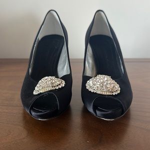 Great condition only one very very small stud has fallen. Great satin shoes!